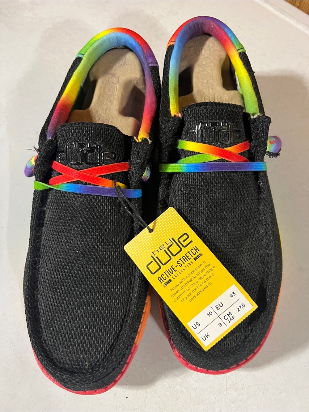 Hey Dude Men’s Black Slip-On Sneakers with Rainbow Trim